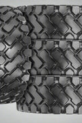 Heavy-duty E-3/L3 bias ply loader tire on warehouse floor

Rock lug pattern close-up for traction

20.5-25 loader tire tread and sidewall view

Mining OTR tire mounted on equipment

Rugged loader tire for industrial applications
