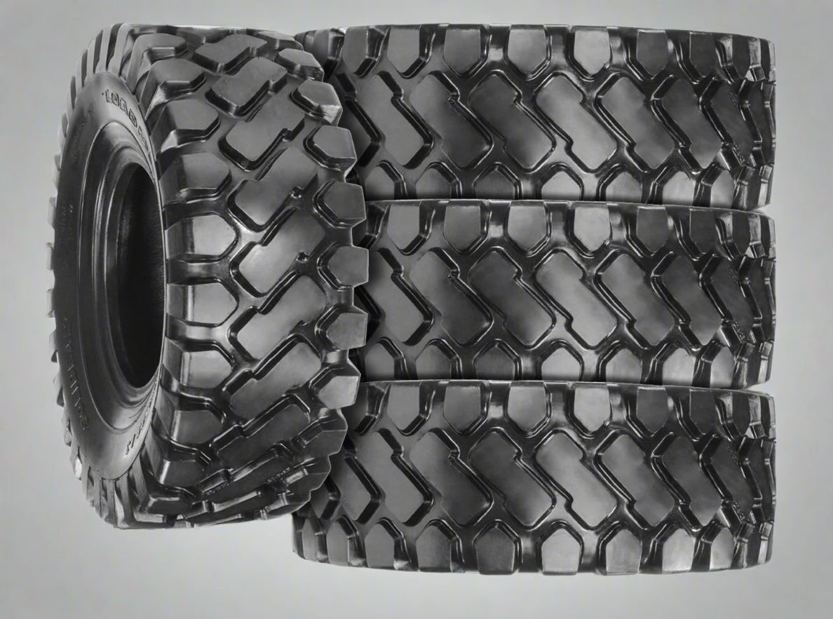 Heavy-duty E-3/L3 bias ply loader tire on warehouse floor

Rock lug pattern close-up for traction

20.5-25 loader tire tread and sidewall view

Mining OTR tire mounted on equipment

Rugged loader tire for industrial applications
