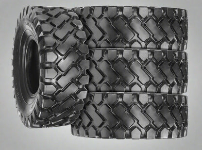 Heavy-duty E-3/L3 bias ply loader tire on warehouse floor

Rock lug pattern close-up for traction

20.5-25 loader tire tread and sidewall view

Mining OTR tire mounted on equipment

Rugged loader tire for industrial applications