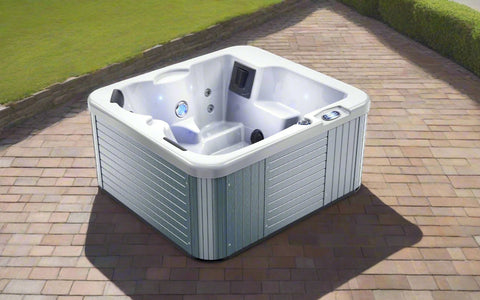 Top-down view of acrylic outdoor spa with seating and jets