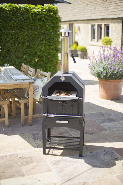"Stainless steel outdoor pizza oven with chimney and stone insert"

"Dual-fuel pizza oven setup with wood and gas burners"

"Outdoor stainless pizza oven in backyard setting"

"Compact portable pizza oven on patio table"

"Fully cooked pizza inside stainless oven"