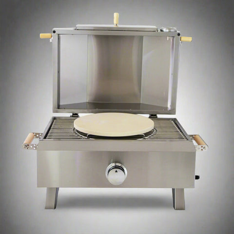 "Stainless steel outdoor pizza oven with chimney and stone insert"

"Dual-fuel pizza oven setup with wood and gas burners"

"Outdoor stainless pizza oven in backyard setting"

"Compact portable pizza oven on patio table"

"Fully cooked pizza inside stainless oven"