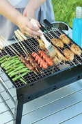 “Compact portable charcoal BBQ grill with food cooking”

“Foldable stainless steel grill for camping”

“Backyard charcoal BBQ grill setup for outdoor use”