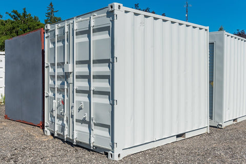 Front view of 8FT gray mini storage container

Side angle of compact steel shipping container

Portable storage containers in different sizes

Bi-parting swing doors and back entry detail

Onsite use of mini steel storage box