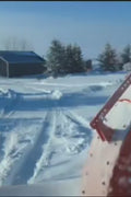 Extreme-duty red snow blower attachment for skid steer – front view

Hydraulic chute adjustment system on 84" snow blower model

72" skid steer snow blower attachment mounted for municipal use

Skid steer operator using snow blower in snowy mountain terrain

Rear hydraulic connection and chute control close-up on snow blower