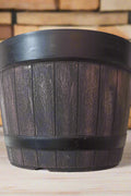 10-inch rustic whiskey barrel-style planter pot set of 5
Close-up of brown plastic whiskey barrel planter with woodgrain finish
Top view of whiskey barrel flower pot for indoor and outdoor gardening