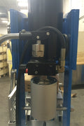 Detailed view of air and hydraulic motor system on industrial shop press