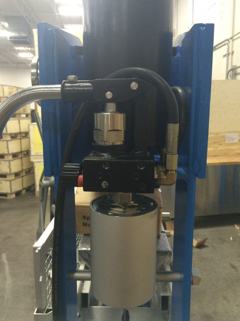 Detailed view of air and hydraulic motor system on industrial shop press