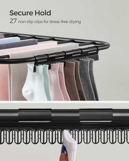 Foldable 2-Level Laundry Drying Rack - Full View
SONGMICS Drying Rack with Adjustable Wings - Side Angle
Foldable Drying Rack with Sock Clips - Close-Up
SONGMICS Indoor Drying Rack in Laundry Room
Foldable Laundry Drying Stand - Compact Storage Mode