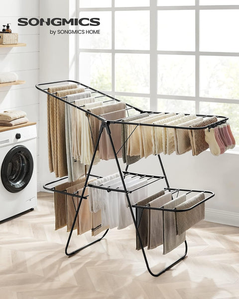 Foldable 2-Level Laundry Drying Rack - Full View
SONGMICS Drying Rack with Adjustable Wings - Side Angle
Foldable Drying Rack with Sock Clips - Close-Up
SONGMICS Indoor Drying Rack in Laundry Room
Foldable Laundry Drying Stand - Compact Storage Mode