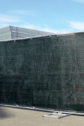 UV-resistant HDPE privacy fence cover attached to outdoor fencing